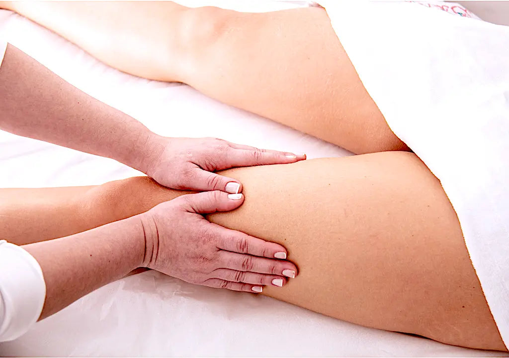 Professional lymphatic drainage massage on the legs to reduce swelling