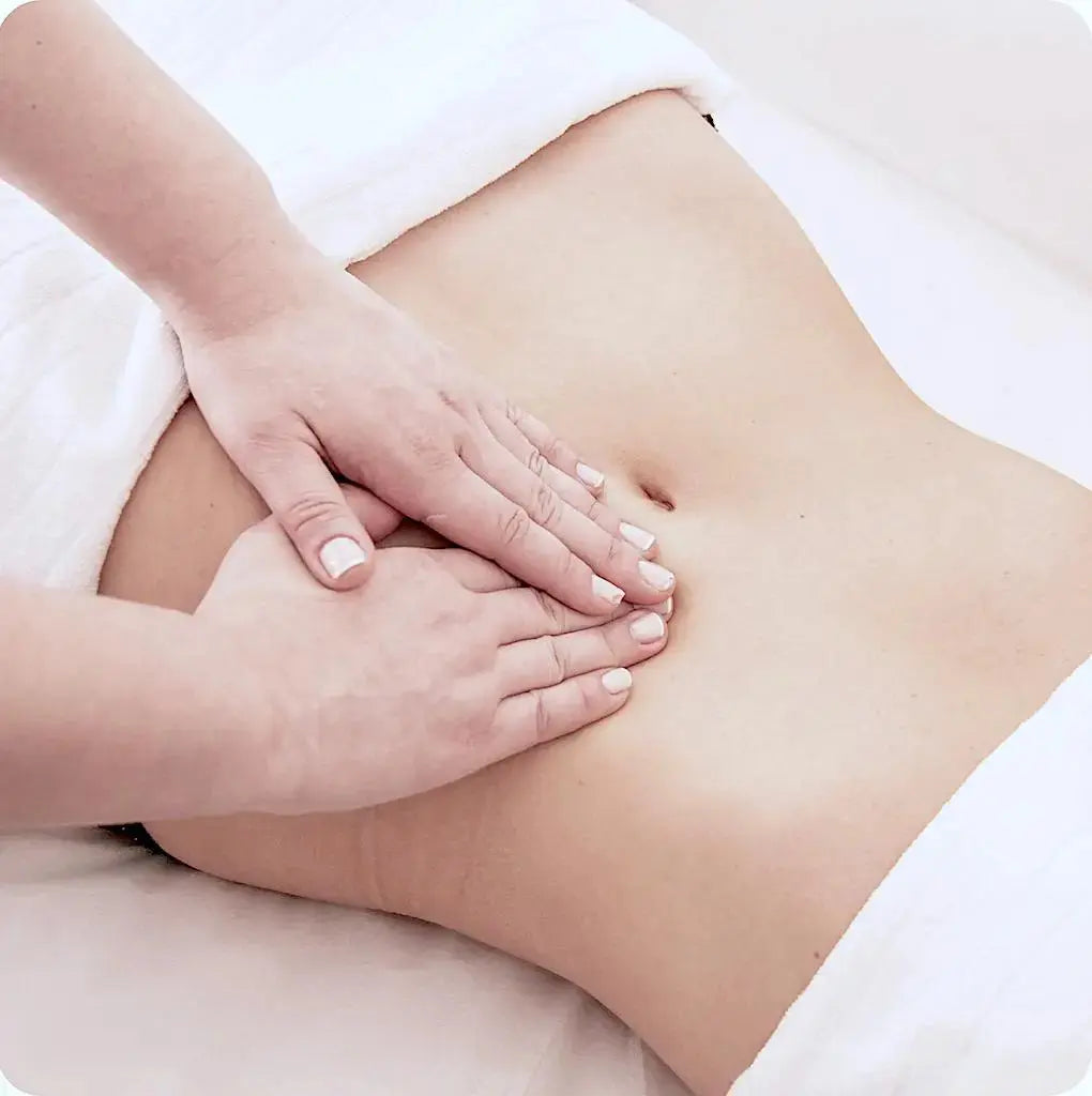 Lymphatic drainage massage on the abdomen to stimulate fluid flow.
